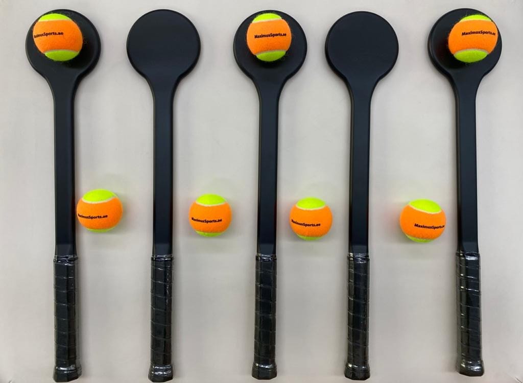Five MAXIMUS Spot Trainers side by side, round contact heads up and handles down, with balls resting on the heads